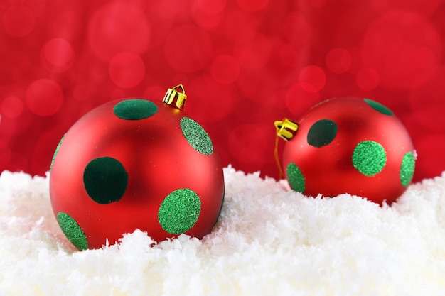 Red Christmas balls on the snow