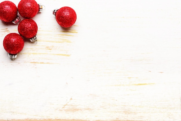 Red Christmas balls on a wood background Large copyspace to insert your message