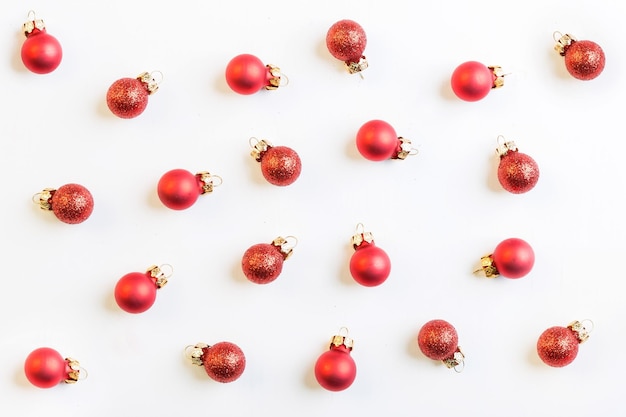 Red christmas baubles on white background