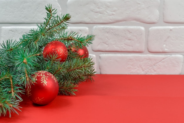 Red christmas decorations on a red background. merry christmas card