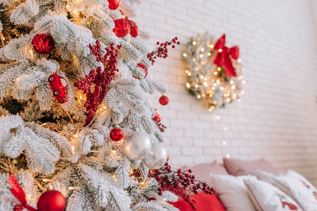 Red Christmas decorations in white bedroom