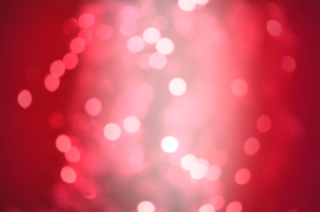 Red Christmas glitter lights background Defocused abstract red background