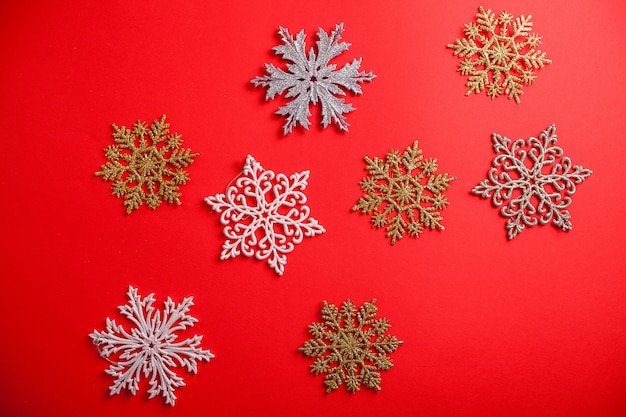 Red Christmas and New Year background with snowflakes. Holiday symbol