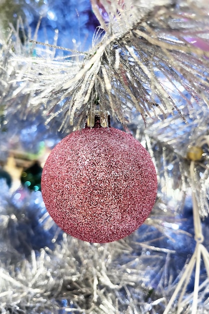 Red Christmas ornament on Christmas tree. Christmas greeting card