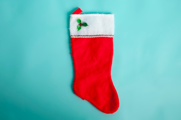 red christmas sock decoration on blue background