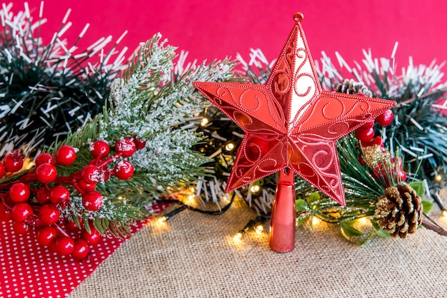 Red Christmas star on a decorated table.