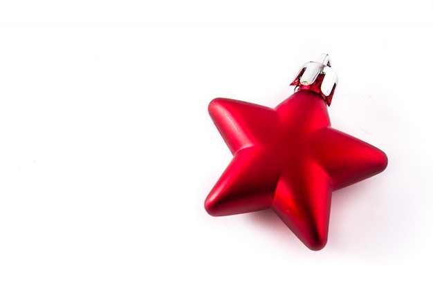 Red Christmas star decoration isolated on white.