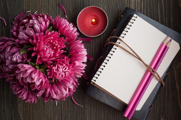 Red chrysanthemum and note book