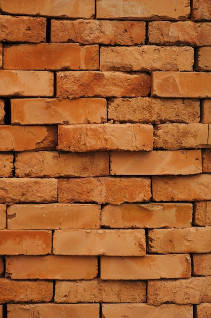 Red clay bricks texture background Backdrop for design Vertical image