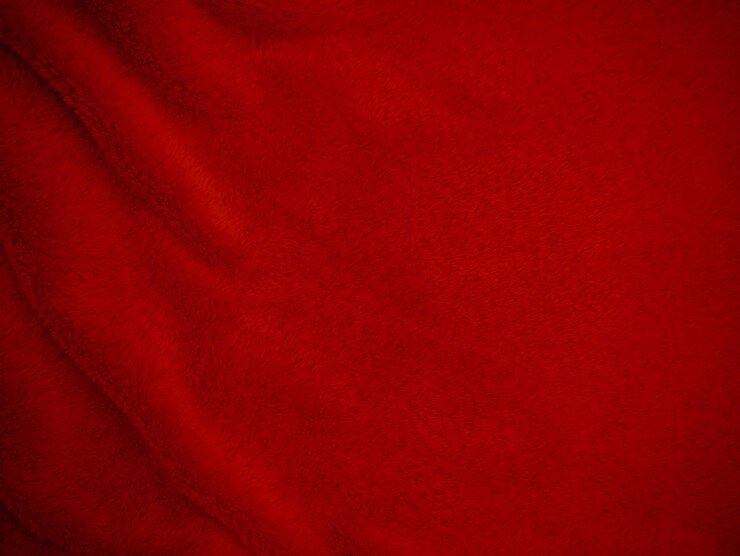 Photo red clean wool texture background light natural sheep wool scarlet seamless cotton texture of fluffy fur for designers closeup fragment red wool fabric carpet