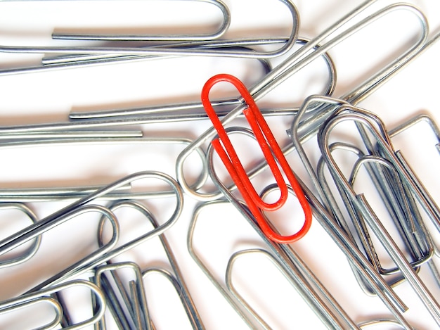 Red clip among silver clips