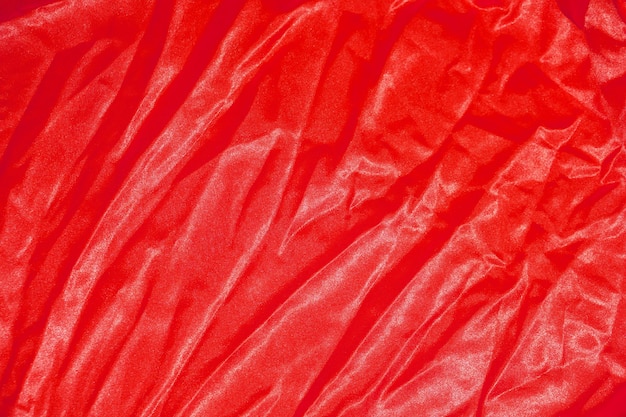 Red cloth background abstract with soft waves