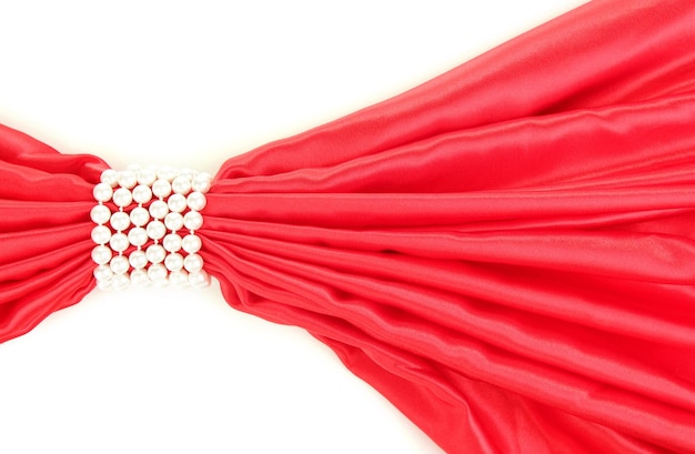 Red cloth tied with pearls isolated on white