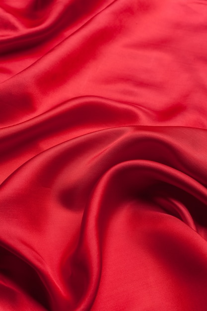 Красная ткань волны фоновой текстуры