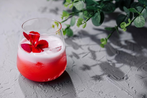 red cocktail white foam red flower