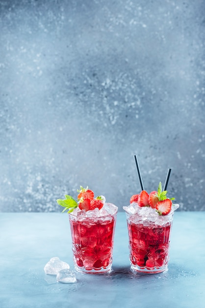 Red cocktail with ice and mint