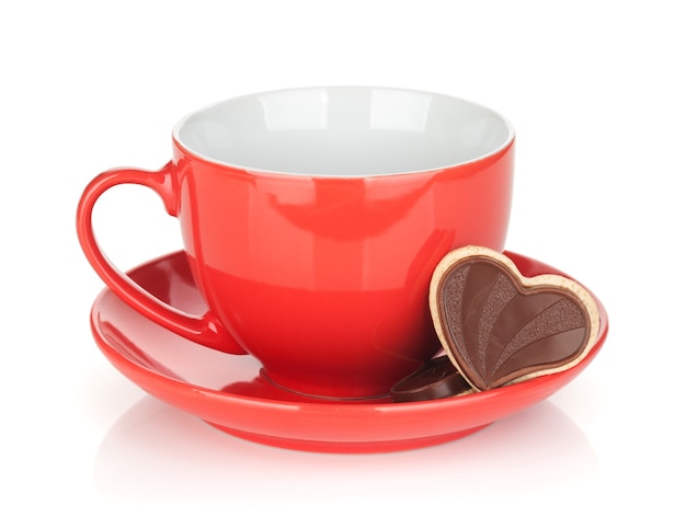 Red coffee cup and chocolate cookies. Isolated on white background