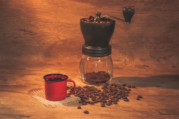 Red coffee mug with coffee grinder