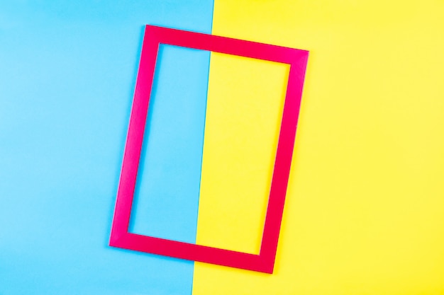 Red color frame on bright yellow and blue background.