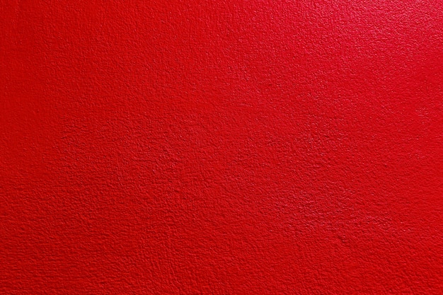 Red color old grunge wall concrete texture as background.
