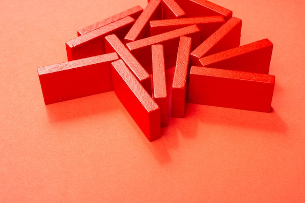 Red color wooden building blocks domino pieces