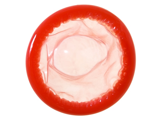 Red condom on white background with clipping path