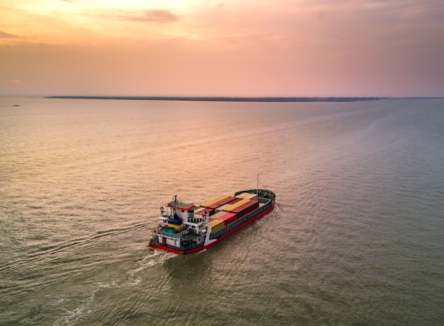 Red container ship in the gulf of Thailand