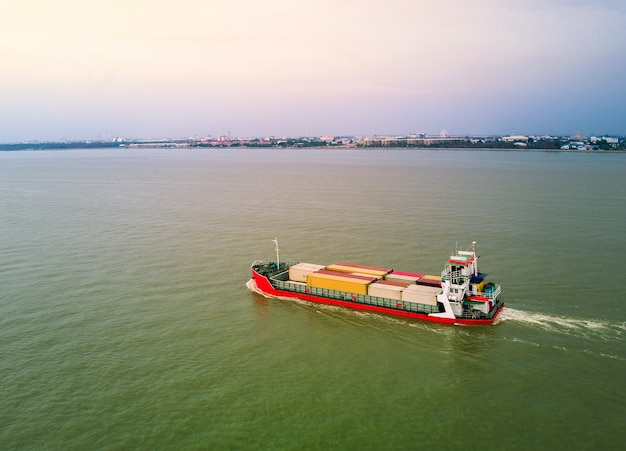 Red container ship in the gulf of Thailand