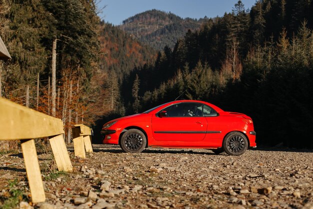 Red convertible in the mountains Traveling in mountains