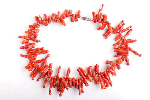 Red coral beads isolated on white background