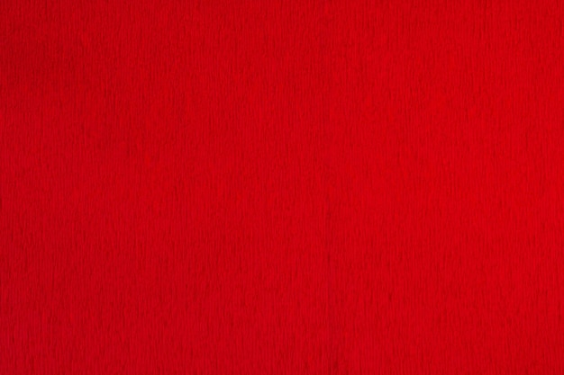 Красная гофрированная бумага фоновой текстуры