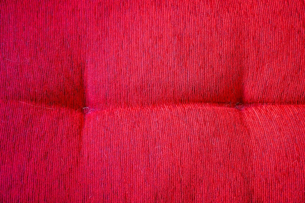 Red cotton cushion Fabric texture pattern Rest concept