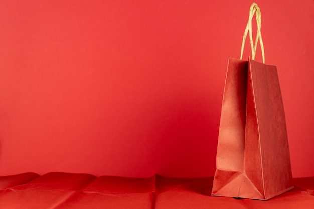 Photo red craft paper bag on red room