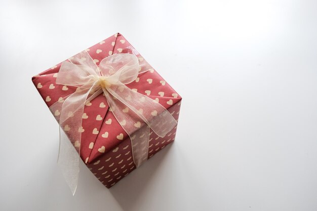 Red Cream Gift Box with Bow Knot Beautifully Decorated Presented as a gift 