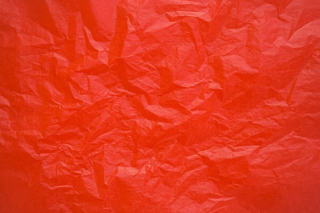 Red crumpled paper texture background