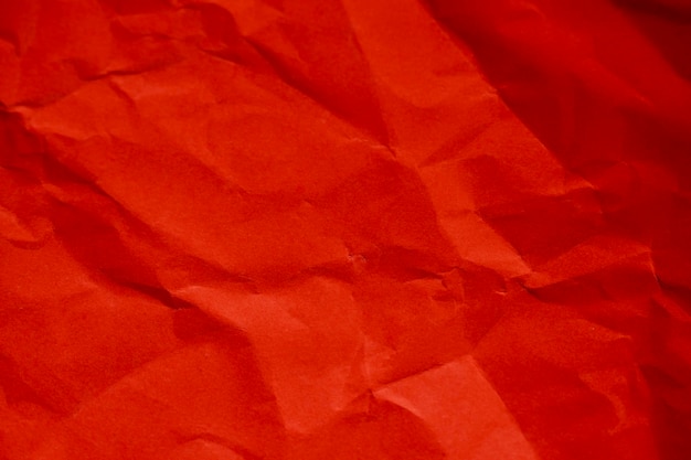 Red crumpled wrinkled paper background