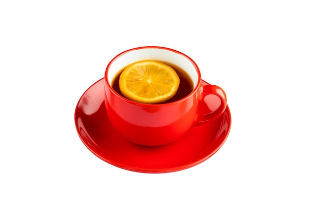 Red cup of black tea with lemon and saucer Object isolated on white background Hot morning seasonal beverage Breakfast break concept Winter warming drink