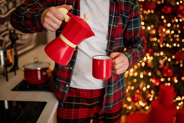 Red cup of coffee in a Christmas