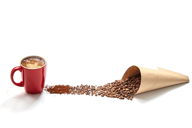 Red cup of coffee, paper bag with coffee beans, crushed beans, ground coffee on a white background