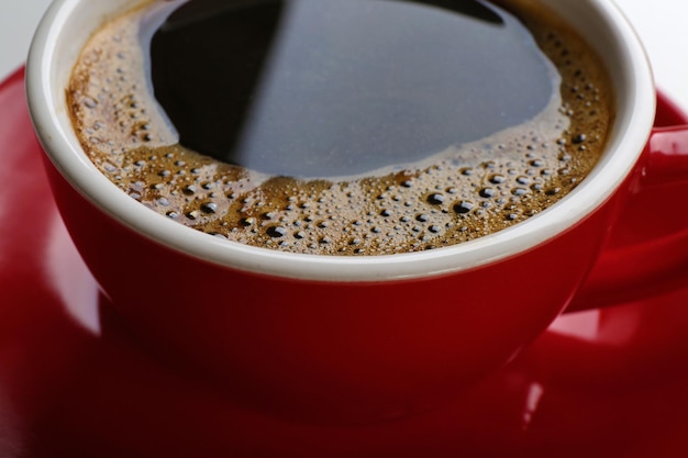 A red cup of tasty coffee closeup