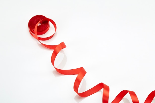 Red curly ribbon isolated on white