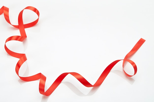 Red curly ribbon isolated on white