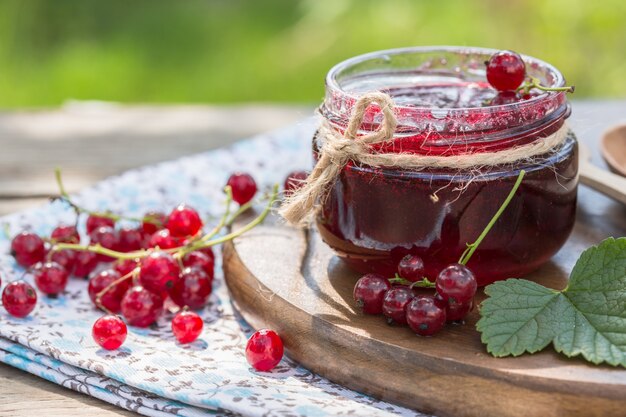 Red currant jam. red currant jam and red currant with
leaves.