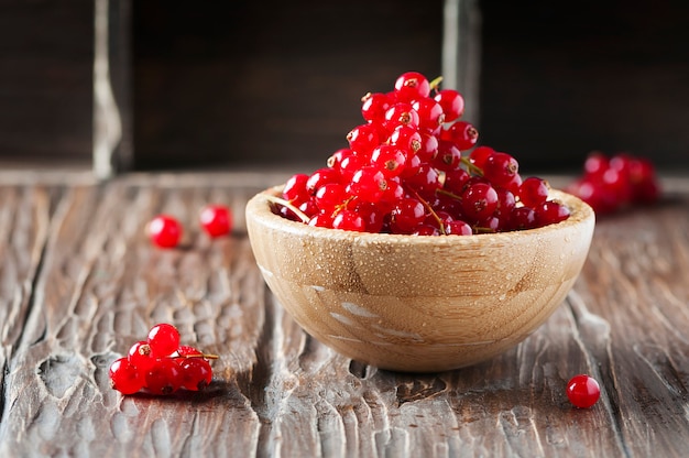 Red currant on the wooden table