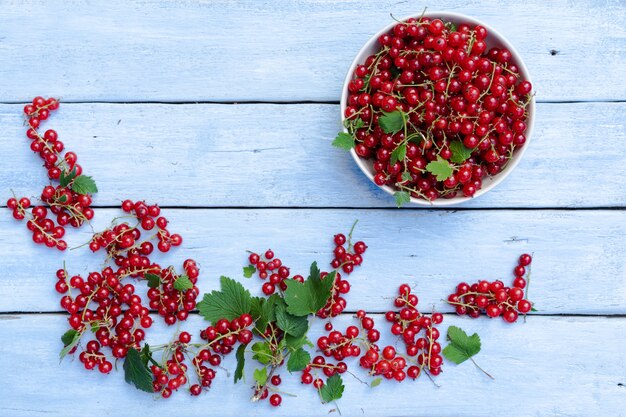 Red currants on a wooden table