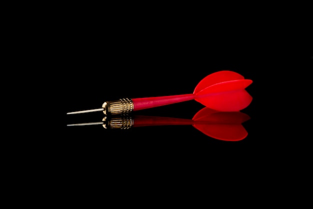 Red dart on black. Hit the target