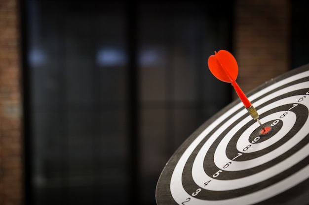 Red dart target arrow hitting on bullseye with, Target marketing and business success concept - Image