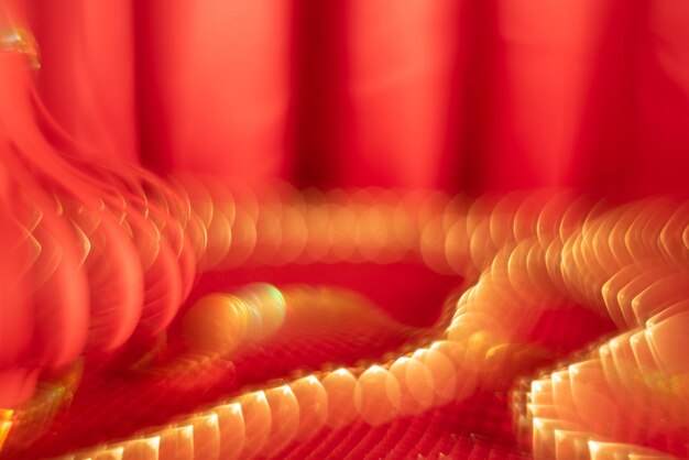 Red defocused abstract background with gold bokeh Asian celebration concept