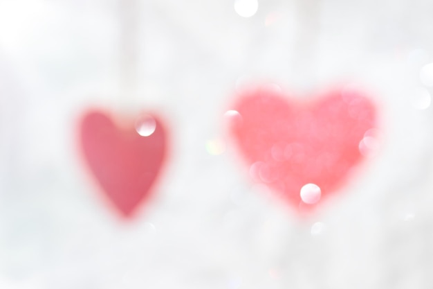 Red defocused hearts abstract light background