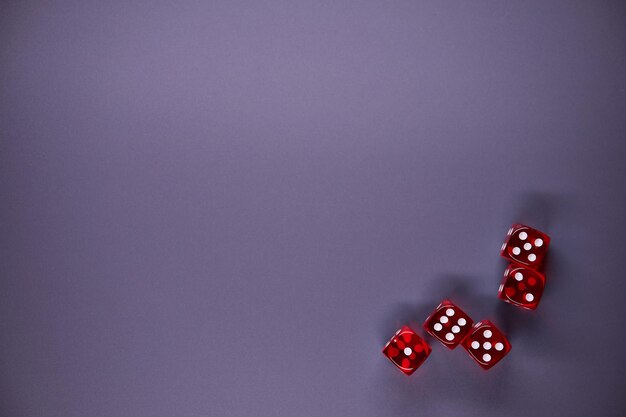 Photo red dices on grey background copy space